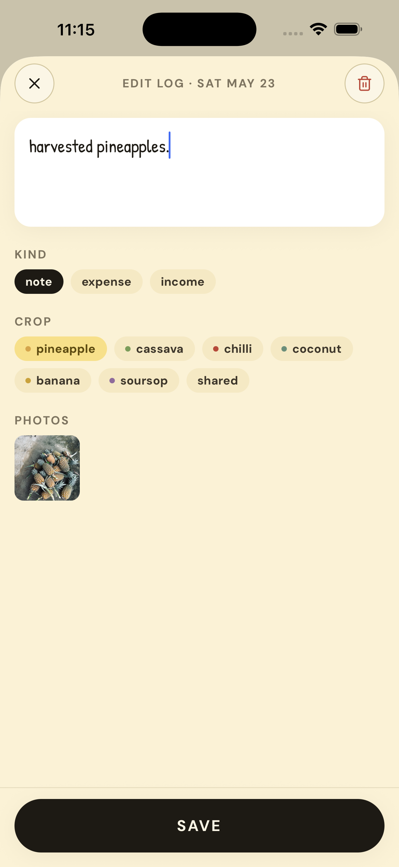 Furrowed's edit-log screen. The note 'harvested pineapples' with crop tag pineapple, photo attached, and a black SAVE button at the bottom.